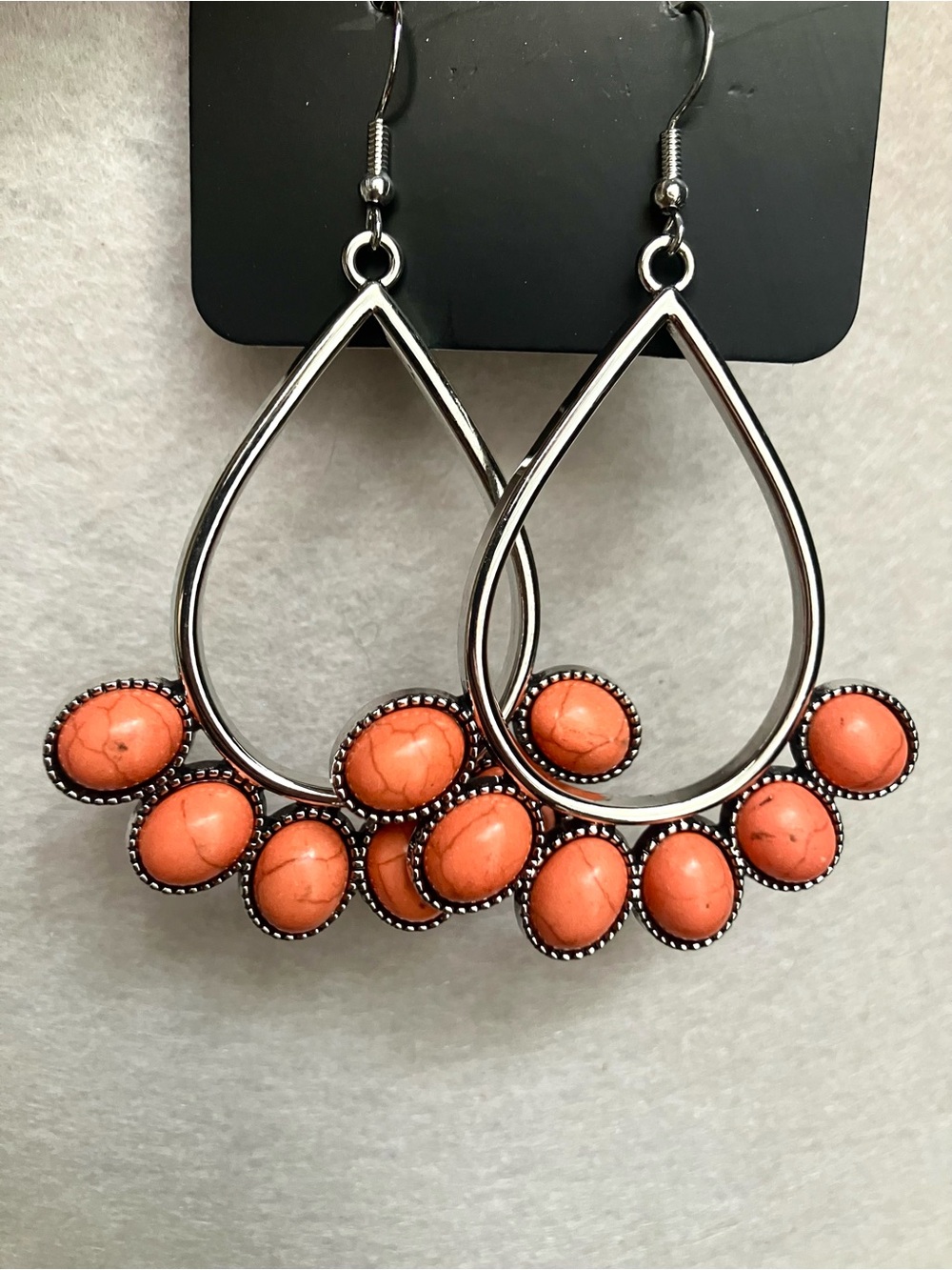 Orange stone silver earrings